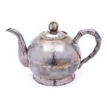 A Chinese hammered silver teapot,