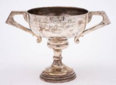 A George V silver twin handled trophy cup, maker's mark worn, Chester, 1924: inscribed,