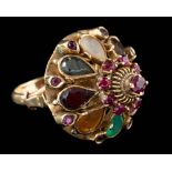 A multi gem set ring,: the domed ring in Navratna style,