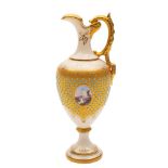 A Coalport 'jewelled' porcelain ewer: painted with a small lake landscape panel reserved on a