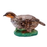 A French porcelain partridge cruet stand and cover: the bird naturalistically modelled and
