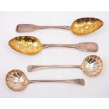 A pair of George III fiddle pattern and later decorated berry spoons,