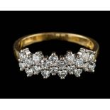 An 18 carat gold and diamond ring,: set with brilliant cut diamonds, approximately 0.