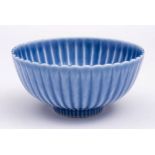 A Chinese lavender blue-glazed 'chrysanthemum' bowl: six-character Yongzheng mark within double