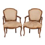 A pair of carved beech and upholstered fauteils in Louis XV style, late 19th / early 20th century,