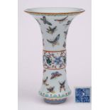 A Chinese famille rose beaker vase: enamelled with colourful butterflies and a band of scrolling