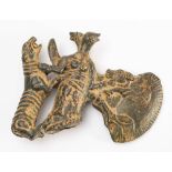 An Uzbekistan bronze age style ceremonial shafthole axe head: decorated with a bird headed demon,