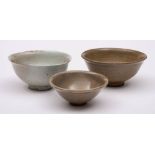 A group of three Chinese celadon glazed bowls,