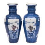 A pair of Chinese underglaze blue and copper-red rouleau vases: each of ovoid form with cylindrical