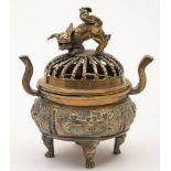 Two Chinese bronze censers: one of cylindrical form decorated in high relief with nine scholars,