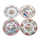 A group of four Chinese famille rose plates: brightly enamelled with cockerels,