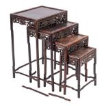 A nest of four Chinese carved and stained hardwood quartetto tables, late 19th / early 20th century,