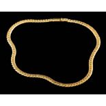 A gold coloured necklace:, the polished curb links to a concealed clasp, stamped 750, 38cm long,