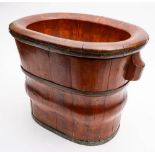 A Chinese softwood and metal bound basin and stand: of oval outline and coopered construction,