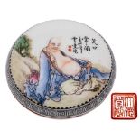 A Chinese porcelain seal paste box and cover: of circular form decorated in famille rose enamels