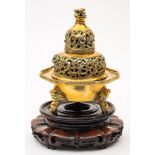 A Chinese bronze censer: of circular form raised on three elephant head supports beneath a