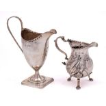 A George III silver cream jug, maker's mark worn, London, 1777: of ovoid from, with crimped rim,