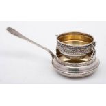 A continental silver tea strainer and stand,