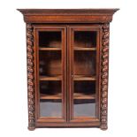 An oak and glazed bookcase in 17th century style, probably French, later 19th century,