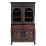 An Anglo-Indian hardwood, probably padouk and glazed cabinet bookcase, second quarter 19th century,