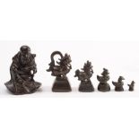 A set of five Chinese graduated bronze opium weights: in the form of mythical beasts,