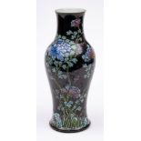 A Chinese famille noire baluster vase: enamelled with flowering peony branches on a black ground,