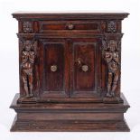 An Italian carved walnut side cabinet or armadietto, probably Umbria or Tuscany,