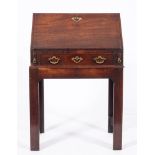 A George II mahogany bureau on stand, mid 18th century and later adapted,