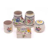 A group of five pieces of Poole Pottery: decorated with a range of floral designs,