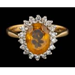An 18 carat gold citrine and diamond ring,