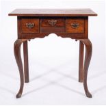 A George II oak and walnut lowboy, mid 18th century and later elements,
