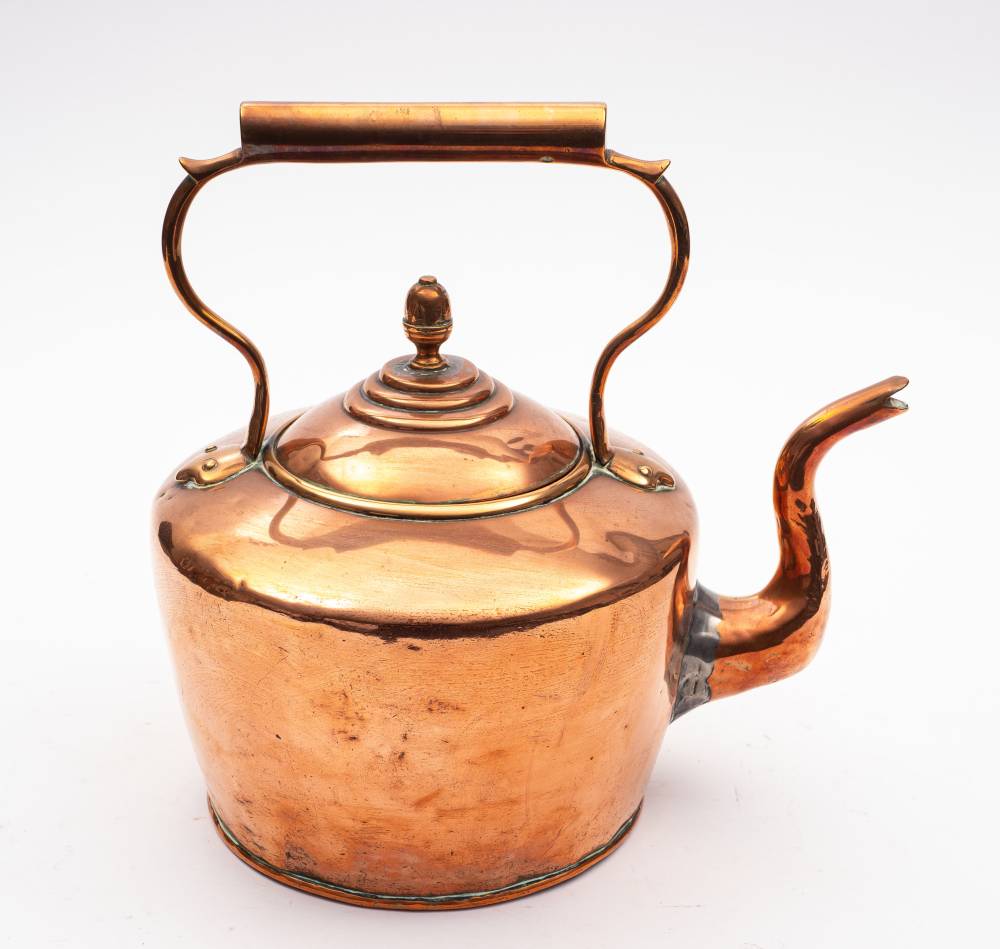 A large 19th century copper kettle: with lift-off lid having an acorn finial and swept spout,