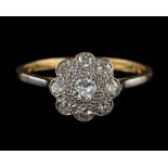 A diamond cluster ring,: set with brilliant cut diamonds, stamped 18ct plat, ring size O 1/2.