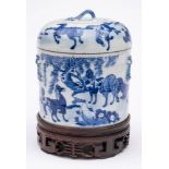 A Chinese porcelain food container and cover: of cylindrical form with faux bamboo handles painted