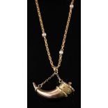 A gold coloured cornucopia pendant,: on a seed pearl set chain, stamped with French control marks.