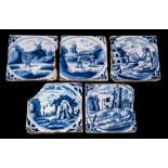 A group of five 18th century English blue and white delftware tiles: four of similar design