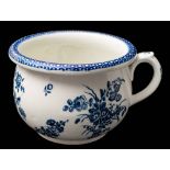 A First Period Worcester blue and white chamber pot: with turn-over rim and scroll handle,