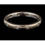 A diamond eternity ring,: set with brilliant cut diamonds,