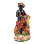 A Derby porcelain figure allegorical of Africa: modelled as a blackamoor in elephant headdress