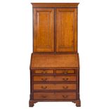 A late George III oak, mahogany crossbanded and chequer inlaid bureau cabinet, early 19th century,
