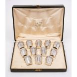 A set of twelve French silver liquor tots, stamped marks: of cylindrical tapering form,