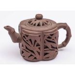 A Chinese yixing 'bamboo' teapot and cover: of reticulated double-walled form, seal marks, 8cm high.