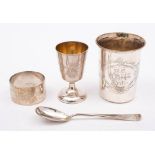 A German silver christening set, stamped marks: includes cup, spoon and napkin ring,