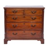 A George III mahogany chest of drawers, circa 1775,: the top with moulded front and side edges,