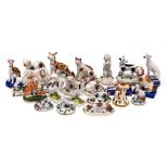 A group of twenty two porcelain figures of dogs: primarily Continental gold anchor and German