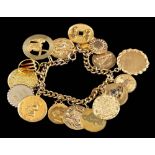 A charm bracelet,: the curb link bracelet with various charms, some gold.