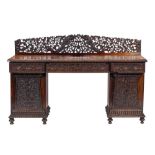 An Anglo-Indian carved and stained hardwood, probably padouk sideboard, 'possibly southern India',