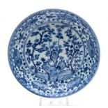 A Chinese blue and white 'Three Friends' saucer dish: the centre painted with 'The Three Friends of