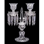 A Baccarat double candlestick: with central spite flanked by two arms supporting wrythen drip pans
