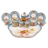 A Royal Worcester porcelain cabaret set: comprising a teapot and cover, sugar bowl, milk jug,